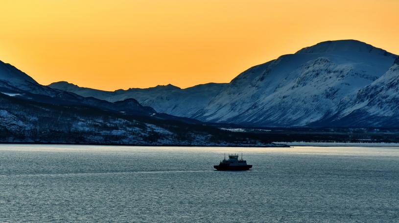 Ship with mountains and orange sky
