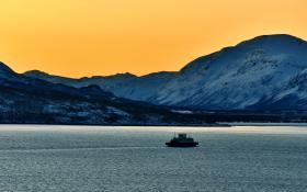 Ship with mountains and orange sky